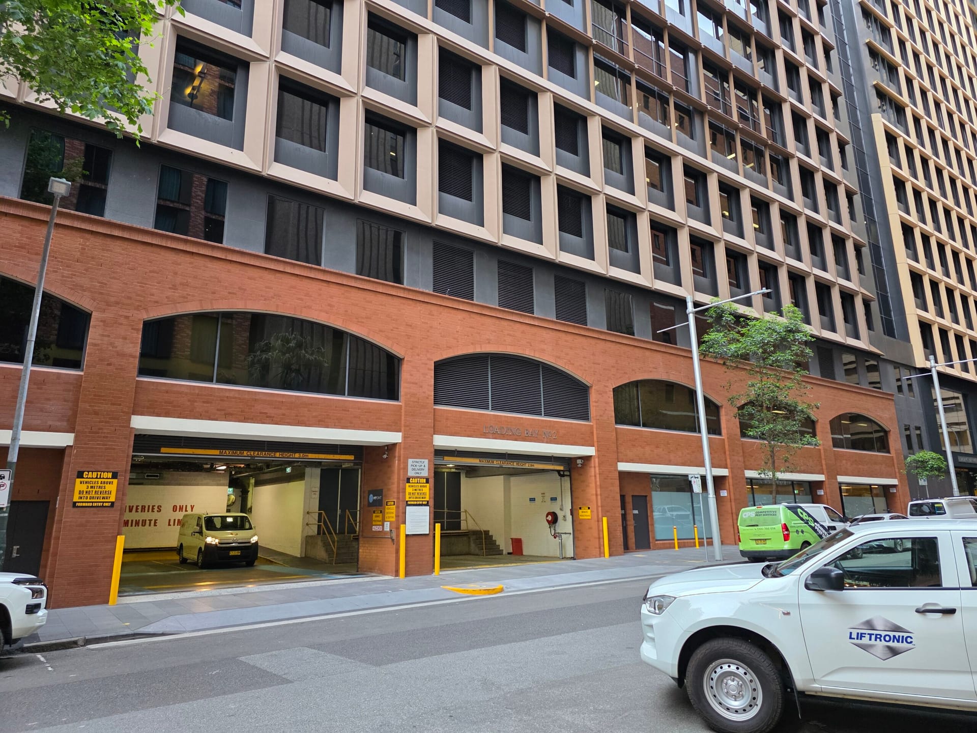 Custom-coloured brickwork and granite façade at 477 on Pitt, Haymarket